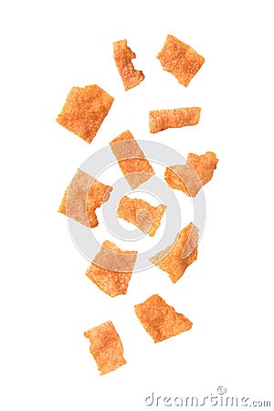 Falling sliced sheets of crispy pork on white background Stock Photo