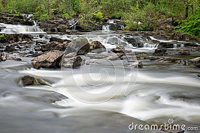 Falls of Dochart near Killin in Scottish Highlands, long exposure Stock Photo