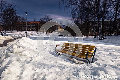 Falun - March 30, 2018: Frozen bench in the center of the town of Falun in Dalarna, Sweden Stock Photo