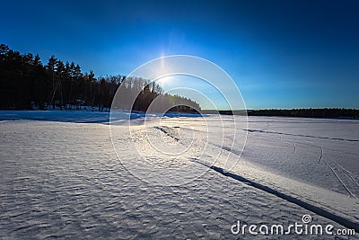 Falun - March 31, 2018: Panorama of the frozen lake of Framby Udde near the town of Falun in Dalarna, Sweden Stock Photo