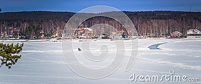 Falun - March 30, 2018: Panorama of the frozen lake at the resort of Framby Udde near the town of Falun in Dalarna, Sweden Editorial Stock Photo