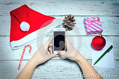 The famale hands with Christmas decorations. Stock Photo