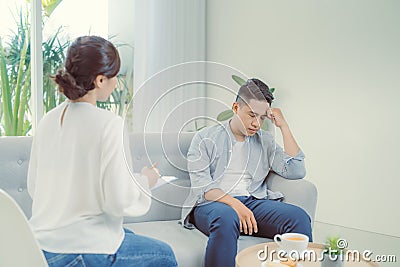 Famale psychiatrist listening to her patient who experienced traumatic events Stock Photo