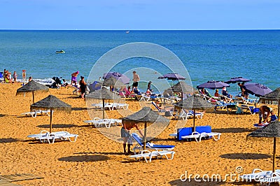 Families enjoying the sun on Albufeira Beach Editorial Stock Photo