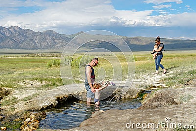 Families and kids enjoying Wild Willy`s Hot Spring Editorial Stock Photo