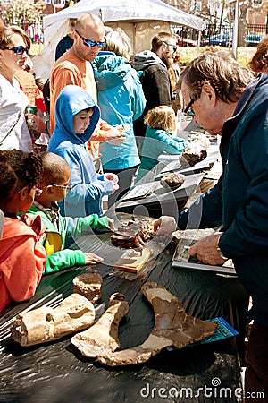 Families Look At Fossils On Display At Atlanta Science Fair Editorial Stock Photo