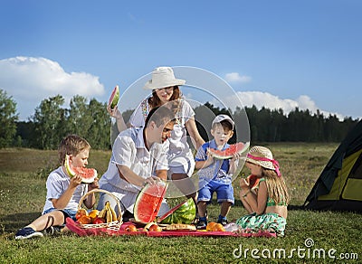 Families picnic outdoors Stock Photo