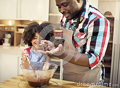 Family baking together in the kitchen Stock Photo