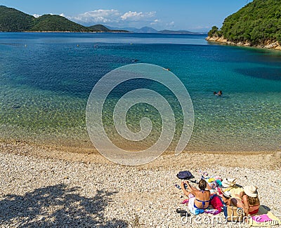 Family on the beach, Ithaca island, Greece Editorial Stock Photo