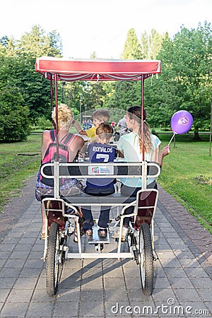 Family bicycle for four people and couples in love. Four wheels bicycle. Editorial Stock Photo