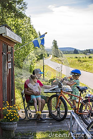 Family biking in Sweden Stock Photo