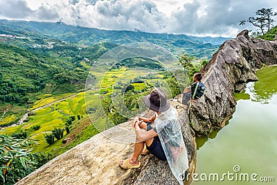 A family of the Black H'mong Ethnic Minority People sit on hill in Sapa, Vietnam on September 14, 2016 Editorial Stock Photo