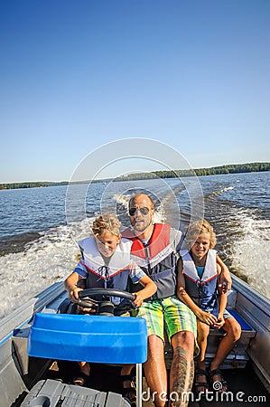Family in a boat Stock Photo