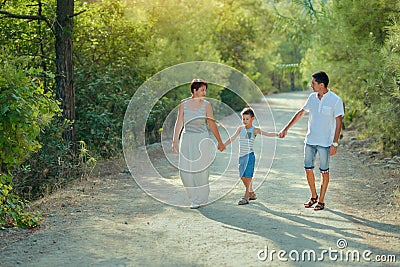 Family with boy in park Stock Photo
