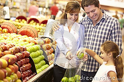 Family buying fruit in supermarket Stock Photo