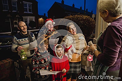 Family Carol Singing Stock Photo