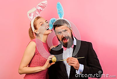 Family celebrate Easter. Bunny couple painting egg. Spring holidays. Stock Photo