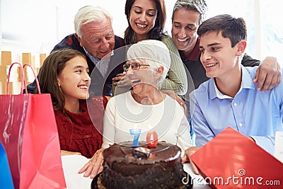 Family Celebrating 70th Birthday Together Stock Photo