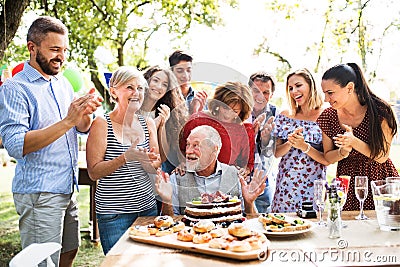 Family celebration or a garden party outside in the backyard. Stock Photo