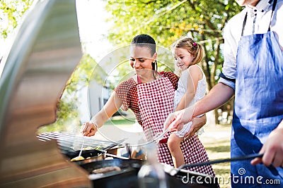 Family celebration or a barbecue party outside in the backyard. Stock Photo