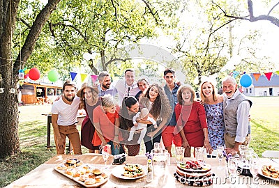 Family celebration or a garden party outside in the backyard. Stock Photo