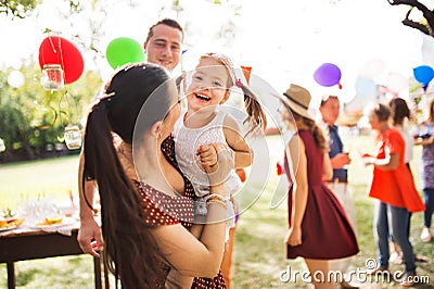 Family celebration or a garden party outside in the backyard. Stock Photo