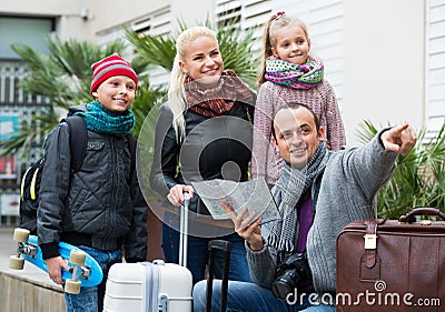 Family checking direction in map Stock Photo
