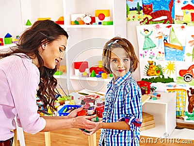 Family with child playing bricks. Stock Photo