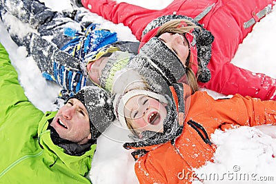 Family and child spending time outdoor in winter Stock Photo