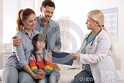 Family with child visiting doctor Stock Photo