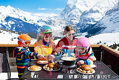 Family apres ski lunch in mountains. Skiing fun Stock Photo