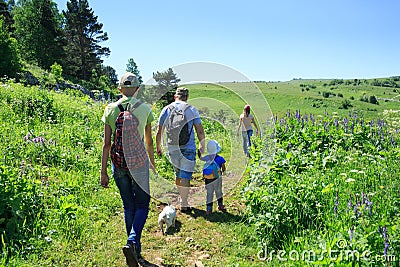 Family with children on a hike Stock Photo