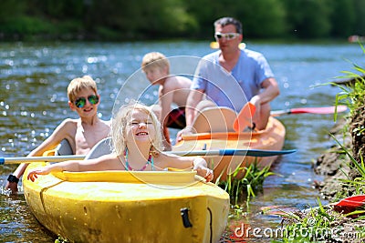 Family with children kayaking on the river Stock Photo