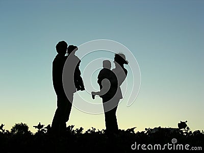 Family with children silhouette Stock Photo