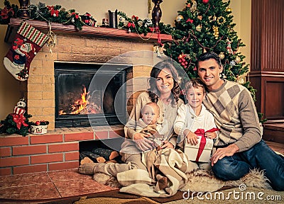 Family in Christmas decorated house interior Stock Photo