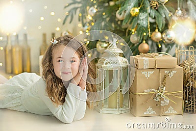 Family on Christmas eve at fireplace. Kids opening Xmas presents. Children under Christmas tree with gift boxes. Decorated living Stock Photo