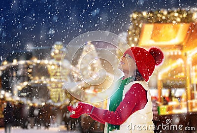 Family at Christmas fair in snow. Xmas market Stock Photo