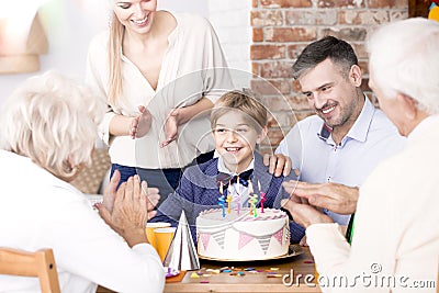 Family clapping their hands at a party Stock Photo