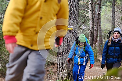 Family climbing the forest mountains Stock Photo