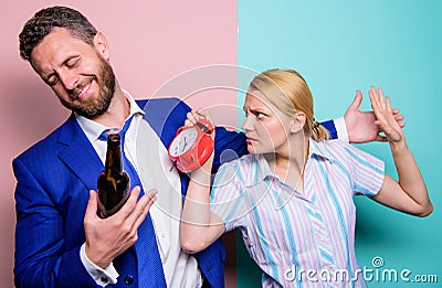 Family conflict. Hangover. Addiction concept. Stop drinking. Girl meet alcoholic guy. Wife and drunk husband drinking Stock Photo