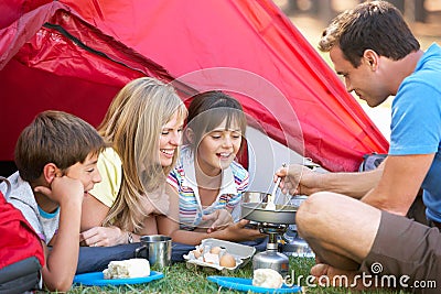 Family Cooking Breakfast On Camping Holiday Stock Photo