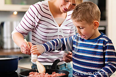 Family cooking in kitchen Stock Photo