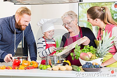 Family cooking in multigenerational household Stock Photo