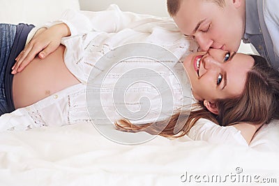 Family couple enjoys a peacefull moment waiting for a baby Stock Photo