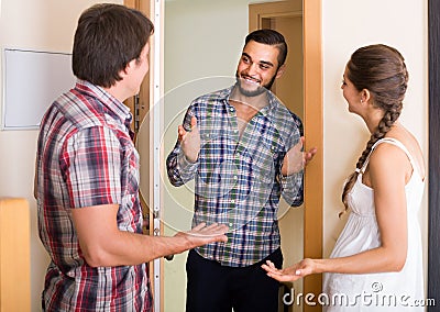 Family couple inviting friend Stock Photo