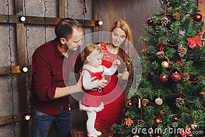 Family decorating christmas tree at home Stock Photo