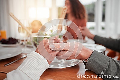 Family, dinner and party, hands together to pray, gratitude for food and love, celebration and holiday. Worship, thank Stock Photo