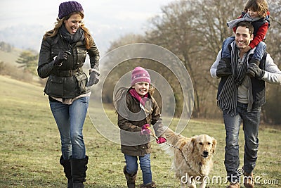 Family and dog on country walk in winter Stock Photo