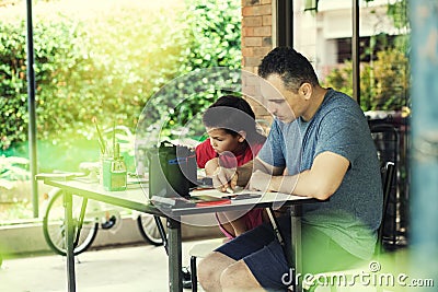 The family draws on the terrace in the summer Stock Photo
