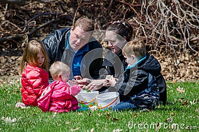 A family at a Easter egg hunt Editorial Stock Photo